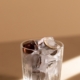 Photo by cottonbro studio: https://www.pexels.com/photo/clear-shot-glass-with-ice-cube-and-coins-5909803/